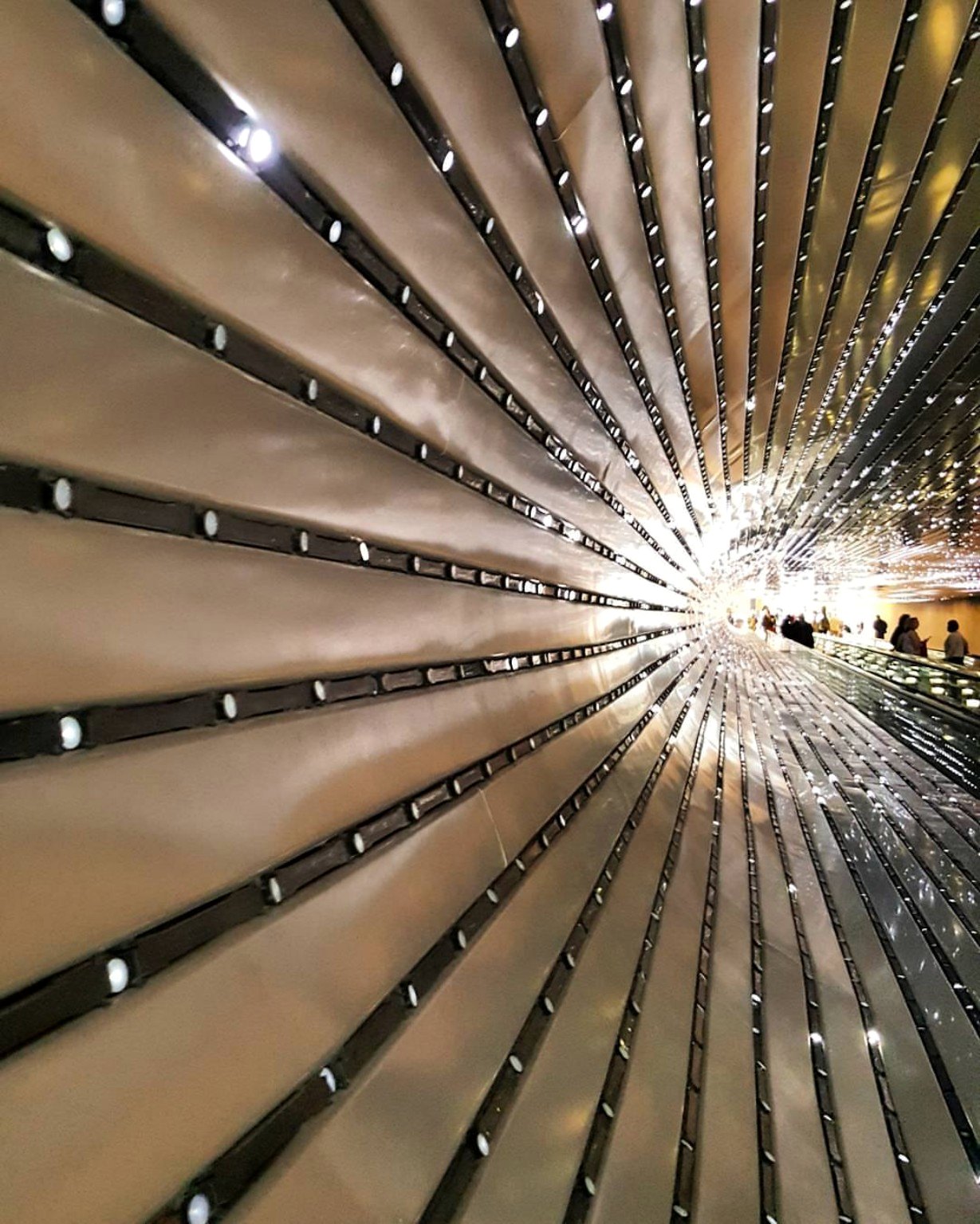Tunnel-like wall of lights converging into brightness